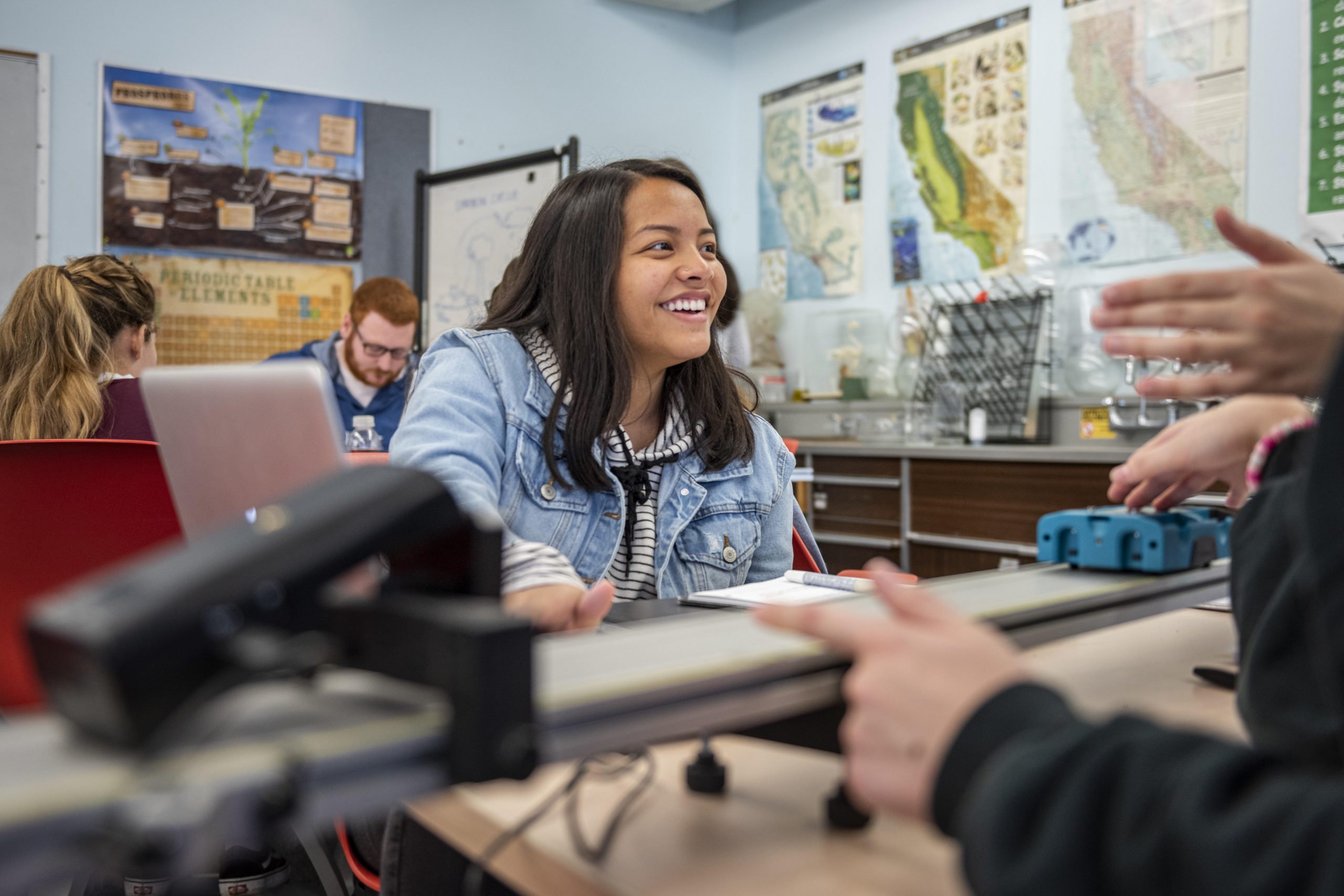 woman in a classroom with long dark hair